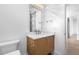 Bathroom vanity with sleek faucet, decorative mirror, pendant lighting, and luxury Kohler toilet at 196 Mountaintop Cir, Pittsboro, NC 27312