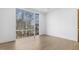 Bright bedroom with hardwood floors and a view of the trees at 196 Mountaintop Cir, Pittsboro, NC 27312