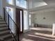 Bright foyer featuring modern stairs and contemporary lighting at 196 Mountaintop Cir, Pittsboro, NC 27312