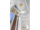 Bright foyer with a high ceiling, a wooden front door, and modern lighting fixtures at 196 Mountaintop Cir, Pittsboro, NC 27312