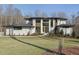 Beautiful modern home featuring manicured landscaping, a front lawn and a symmetrical facade at 196 Mountaintop Cir, Pittsboro, NC 27312