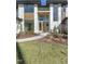 Beautiful modern home with a well-maintained lawn and landscaped garden at the entrance at 196 Mountaintop Cir, Pittsboro, NC 27312
