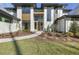 Stunning modern home featuring a manicured lawn and elegant walkway leading to the front door at 196 Mountaintop Cir, Pittsboro, NC 27312
