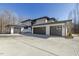 Home's three-car garage featuring contemporary design and ample parking space at 196 Mountaintop Cir, Pittsboro, NC 27312