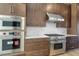 Modern kitchen with stainless steel appliances and white countertop at 196 Mountaintop Cir, Pittsboro, NC 27312