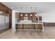 Modern kitchen with stainless steel appliances, quartz countertops, custom cabinetry and hardwood flooring at 196 Mountaintop Cir, Pittsboro, NC 27312