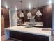 Spacious kitchen featuring dark cabinetry, white marble countertops, and stainless steel appliances at 196 Mountaintop Cir, Pittsboro, NC 27312