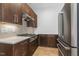 Well-lit kitchen featuring stainless steel appliances, wooden cabinets and light countertops at 196 Mountaintop Cir, Pittsboro, NC 27312