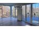 Bright living room featuring large windows, hardwood floors, and modern lighting at 196 Mountaintop Cir, Pittsboro, NC 27312