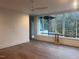 Bright and airy living room with hardwood floors and large windows offering a view of the outdoors at 196 Mountaintop Cir, Pittsboro, NC 27312