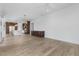 Spacious living area with hardwood floors connecting to the kitchen and featuring custom cabinets at 196 Mountaintop Cir, Pittsboro, NC 27312