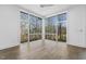 Bright living room with large windows and hardwood floors overlooking the landscape at 196 Mountaintop Cir, Pittsboro, NC 27312