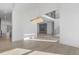 Spacious living area featuring hardwood floors, an open floor plan, and modern lighting at 196 Mountaintop Cir, Pittsboro, NC 27312