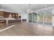 Open floor plan with modern kitchen, living space, large sliding glass doors that offers a seamless indoor-outdoor flow at 196 Mountaintop Cir, Pittsboro, NC 27312