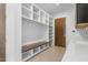Mud room with built-in bench, storage, and dark cabinets with sink at 196 Mountaintop Cir, Pittsboro, NC 27312