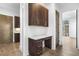 Home office area with built-in desk, cabinets, and drawers, with hardwood flooring at 196 Mountaintop Cir, Pittsboro, NC 27312
