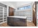 Well-organized walk-in closet with custom shelving, drawers, and natural light from a large window at 196 Mountaintop Cir, Pittsboro, NC 27312