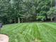 View of the beautiful, well maintained backyard and landscaping at 2012 Silverleaf Dr, Youngsville, NC 27596