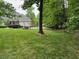 Spacious backyard with luscious grass and mature trees at 2012 Silverleaf Dr, Youngsville, NC 27596