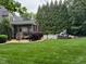 View of the home with a screened porch and in-ground pool at 2012 Silverleaf Dr, Youngsville, NC 27596