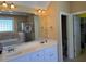 Bathroom with double vanity, walk-in shower, tub, and walk-in closet at 2012 Silverleaf Dr, Youngsville, NC 27596