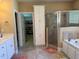 Bathroom with walk-in shower, soaking tub, and walk-in closet at 2012 Silverleaf Dr, Youngsville, NC 27596