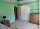 Spacious bedroom featuring an entry, closet, shelving, and wood dresser at 2012 Silverleaf Dr, Youngsville, NC 27596