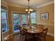 Cozy dining area with backyard views and ample natural light for enjoyable Gathering meals at 2012 Silverleaf Dr, Youngsville, NC 27596