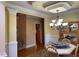 Formal dining room with chandelier, china cabinet, and hardwood flooring at 2012 Silverleaf Dr, Youngsville, NC 27596