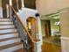 Elegant foyer with a staircase and views into the dining room, creating a grand entrance at 2012 Silverleaf Dr, Youngsville, NC 27596