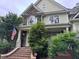 Close-up of a beautiful home featuring stone accents, a brick staircase, and lush landscaping at 2012 Silverleaf Dr, Youngsville, NC 27596