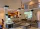 Open-concept living room with kitchen access and comfortable sectional sofa at 2012 Silverleaf Dr, Youngsville, NC 27596