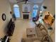 Aerial view of the open-concept living room with fireplace, neutral furnishings, and large windows at 2012 Silverleaf Dr, Youngsville, NC 27596