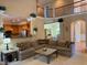 Open-concept living room with kitchen access and comfortable sectional sofa at 2012 Silverleaf Dr, Youngsville, NC 27596