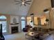 Bright living room with fireplace, windows, and comfortable seating at 2012 Silverleaf Dr, Youngsville, NC 27596