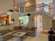 Open-concept living room with kitchen access and comfortable sectional sofa at 2012 Silverleaf Dr, Youngsville, NC 27596