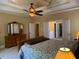 Main bedroom with tray ceilings, a dresser, and walk-in closet at 2012 Silverleaf Dr, Youngsville, NC 27596