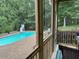 Relaxing screened in porch overlooking the pool at 2012 Silverleaf Dr, Youngsville, NC 27596