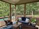 Cozy screened porch featuring wicker furniture, views of the lush backyard, and a relaxing atmosphere at 2012 Silverleaf Dr, Youngsville, NC 27596