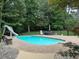 Beautiful fenced in swimming pool with an awesome slide at 2012 Silverleaf Dr, Youngsville, NC 27596