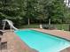 Beautiful swimming pool with slide and backyard furniture at 2012 Silverleaf Dr, Youngsville, NC 27596