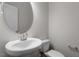 Powder room featuring a pedestal sink and neutral gray paint at 255 Chesapeake Commons St # 90, Garner, NC 27529