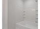 Bathroom featuring a soaking tub with white tile and gray paint at 255 Chesapeake Commons St # 90, Garner, NC 27529