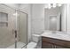 Modern bathroom featuring a glass door shower with tile surround, neutral walls, and sleek vanity at 255 Chesapeake Commons St # 90, Garner, NC 27529