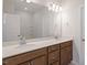 Bathroom featuring double sinks with wooden cabinetry and a large mirror at 255 Chesapeake Commons St # 90, Garner, NC 27529