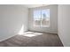 Bedroom with plush carpeting and a large window providing natural light at 255 Chesapeake Commons St # 90, Garner, NC 27529