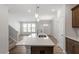 Stylish kitchen island with quartz countertop and stainless steel sink at 255 Chesapeake Commons St # 90, Garner, NC 27529