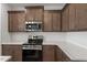 Updated kitchen showcasing stainless steel oven and a subway tile backsplash at 255 Chesapeake Commons St # 90, Garner, NC 27529