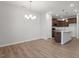 Open floor plan featuring a kitchen island with sink and seating at 255 Chesapeake Commons St # 90, Garner, NC 27529