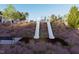 Community playground featuring multiple slides and benches landscaped with native grasses at 255 Chesapeake Commons St # 90, Garner, NC 27529